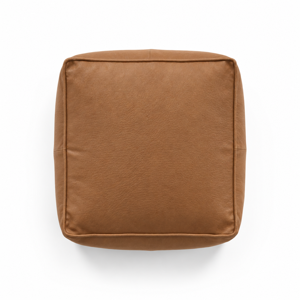 Lanott P103 pouf in Cognac Leather, overhead top view on white background with refined leather grain