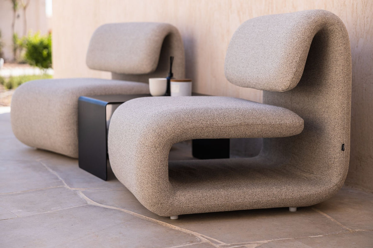 Lanott statement chair on a stone floor