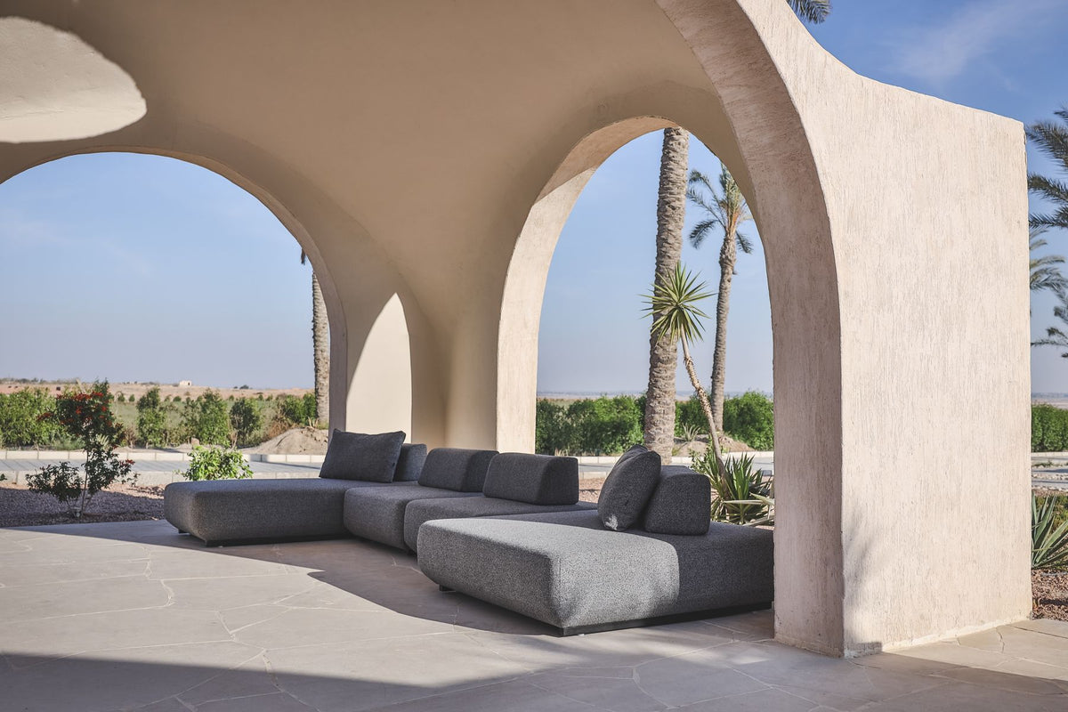 Lanott modular sofas beneath arched openings