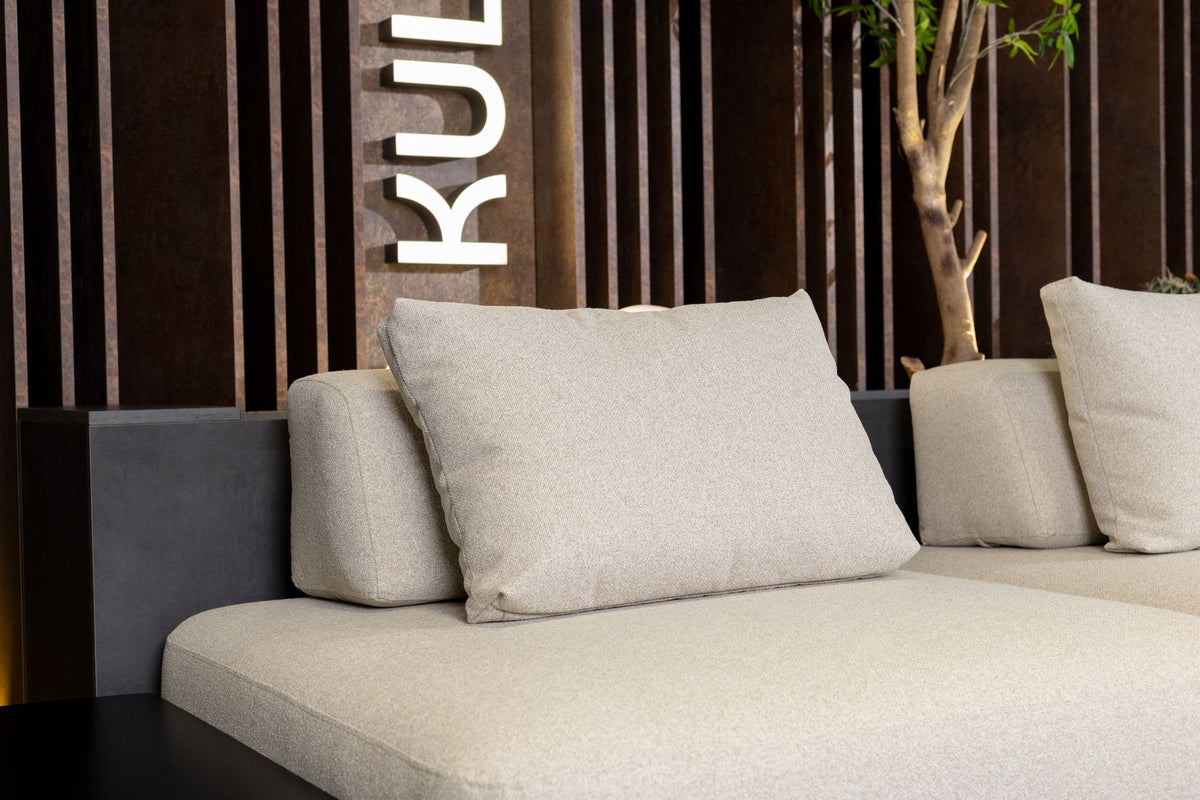 Lanott sofa detail against a slatted wood wall