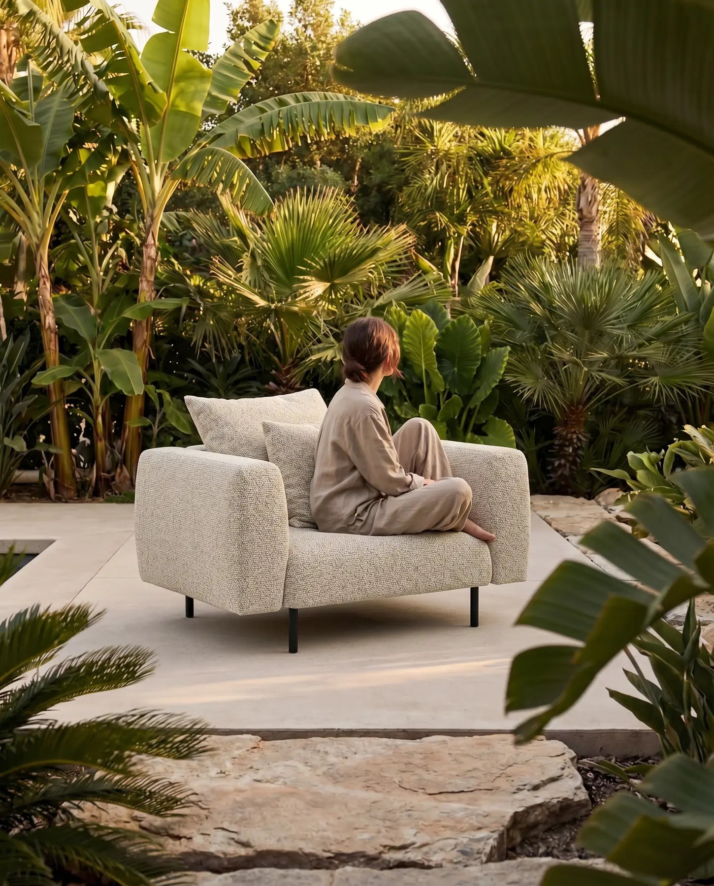Lanott boucle armchair in a garden setting
